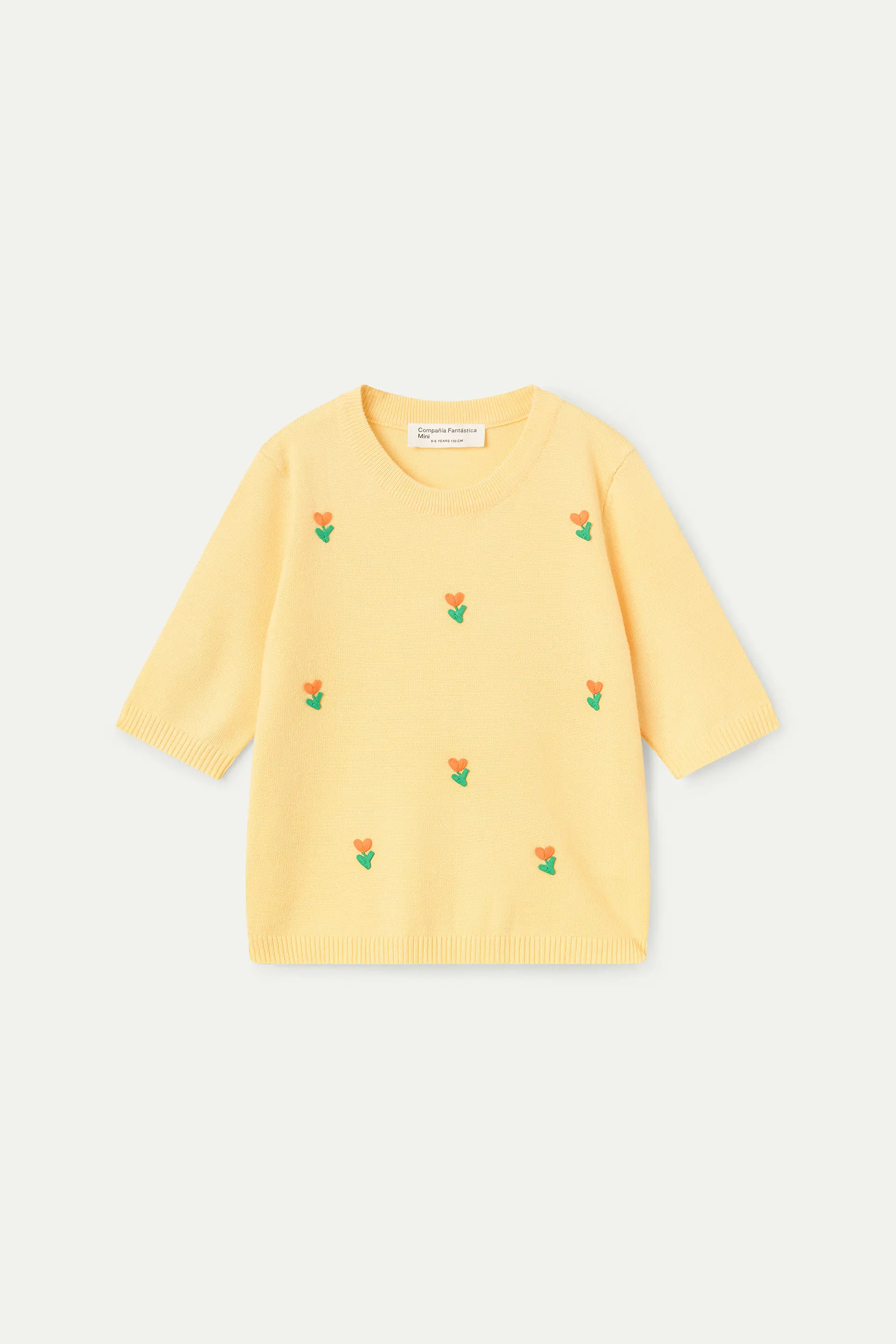 Top de ni?a punto amarillo con detalle floral