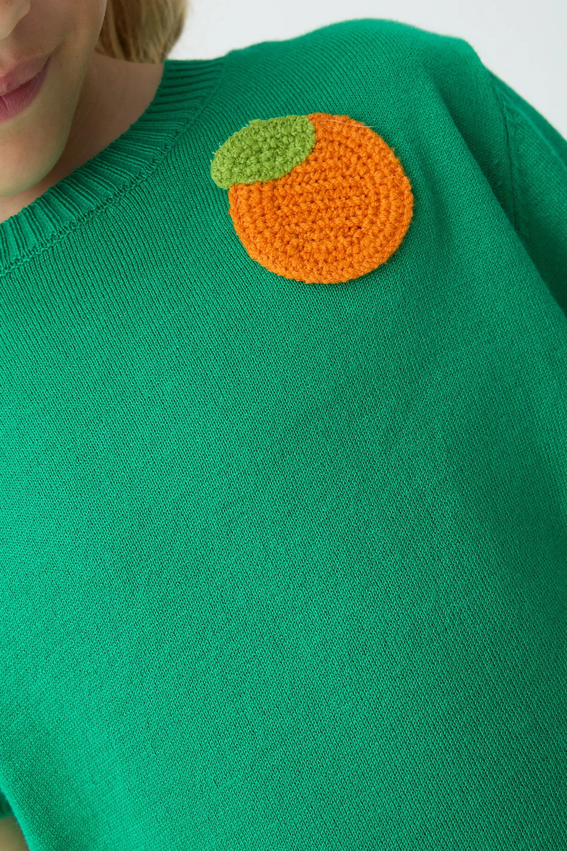 Top de ni?a  con bordado de naranja